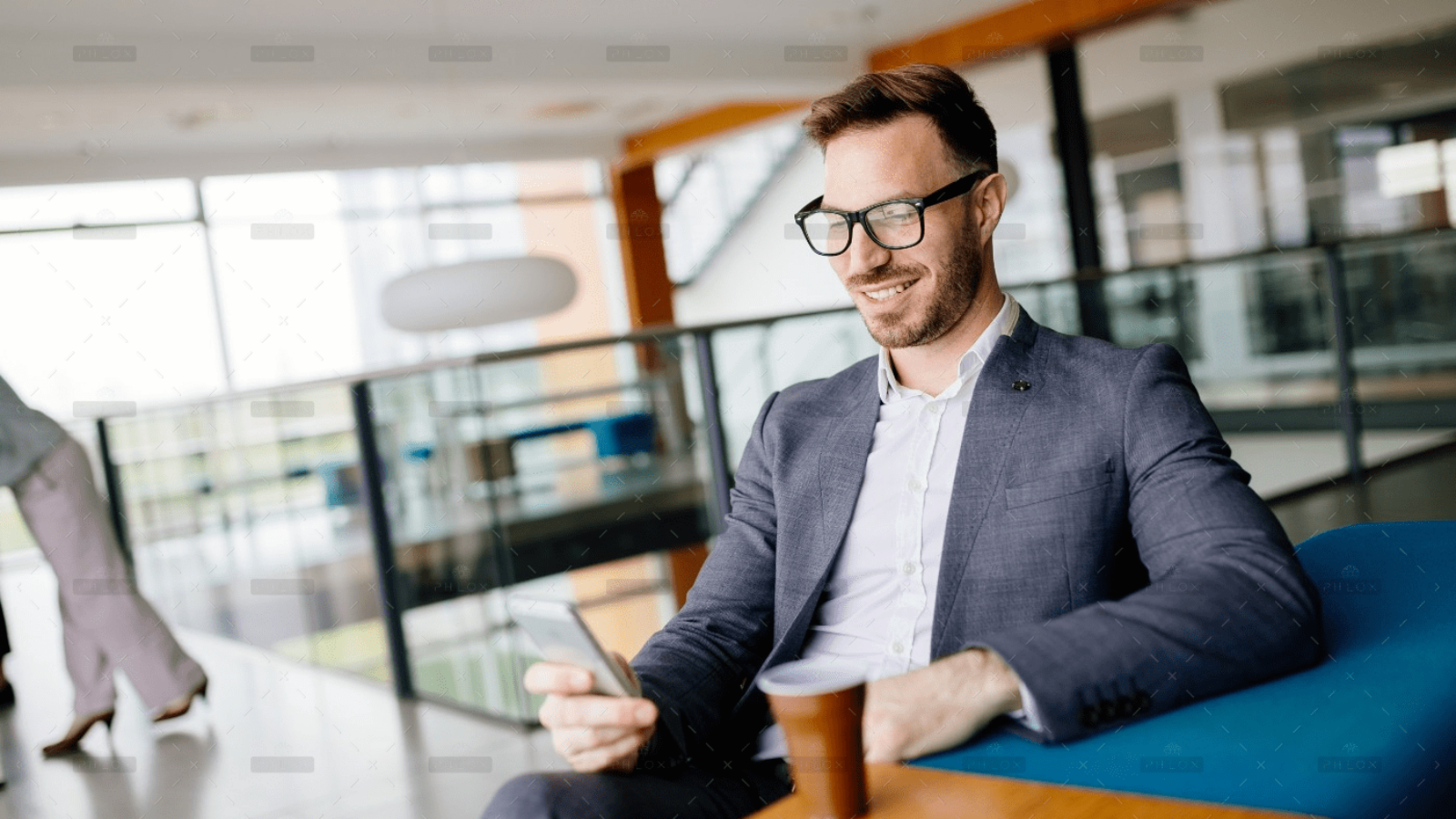 demo-attachment-713-businessman-taking-a-break-with-a-cup-of-coffee-JW4B3DH